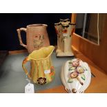 A Carlton ware yellow ground jug with floral design together with an Art Deco design floral vase by