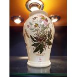 A Portmerion 'Botanic' garden baluster shaped vase decorated with Christmas rose and butterflies