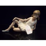 A Nao ballerina in reclining position,