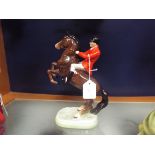 A Beswick huntsman on rearing horse, no.