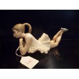 A Nao ballerina in laying position,