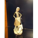 A Lladro figurine of a young girl with milk pail and duck,