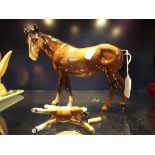 A large Beswick horse in brown gloss together with a similar small foal (A/F)