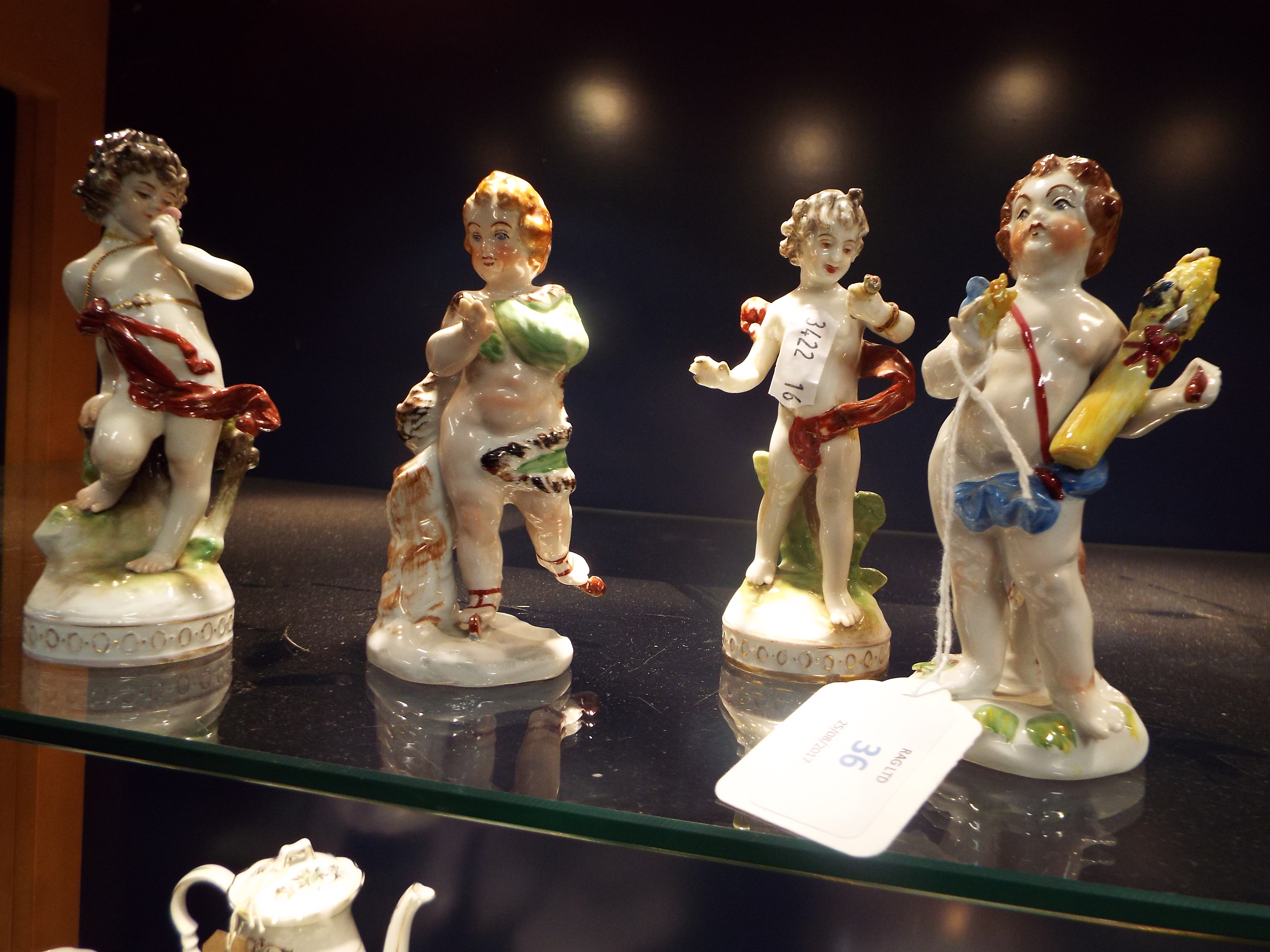 Two pairs of Continental figurines of classical figures