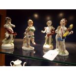 Two pairs of Continental figurines of classical figures