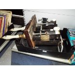 A pair of brass and ceramic mahogany beer pumps for Badger Ale and a bar top Kalibar bottle opener