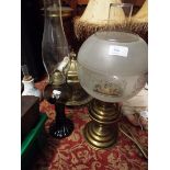 Two glass oil lamps