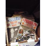 A selection of vintage 'Tin-Tin' and 'Asterix' comics, music annuals, Rolling Stones books,