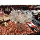 A glass punch bowl and accessories