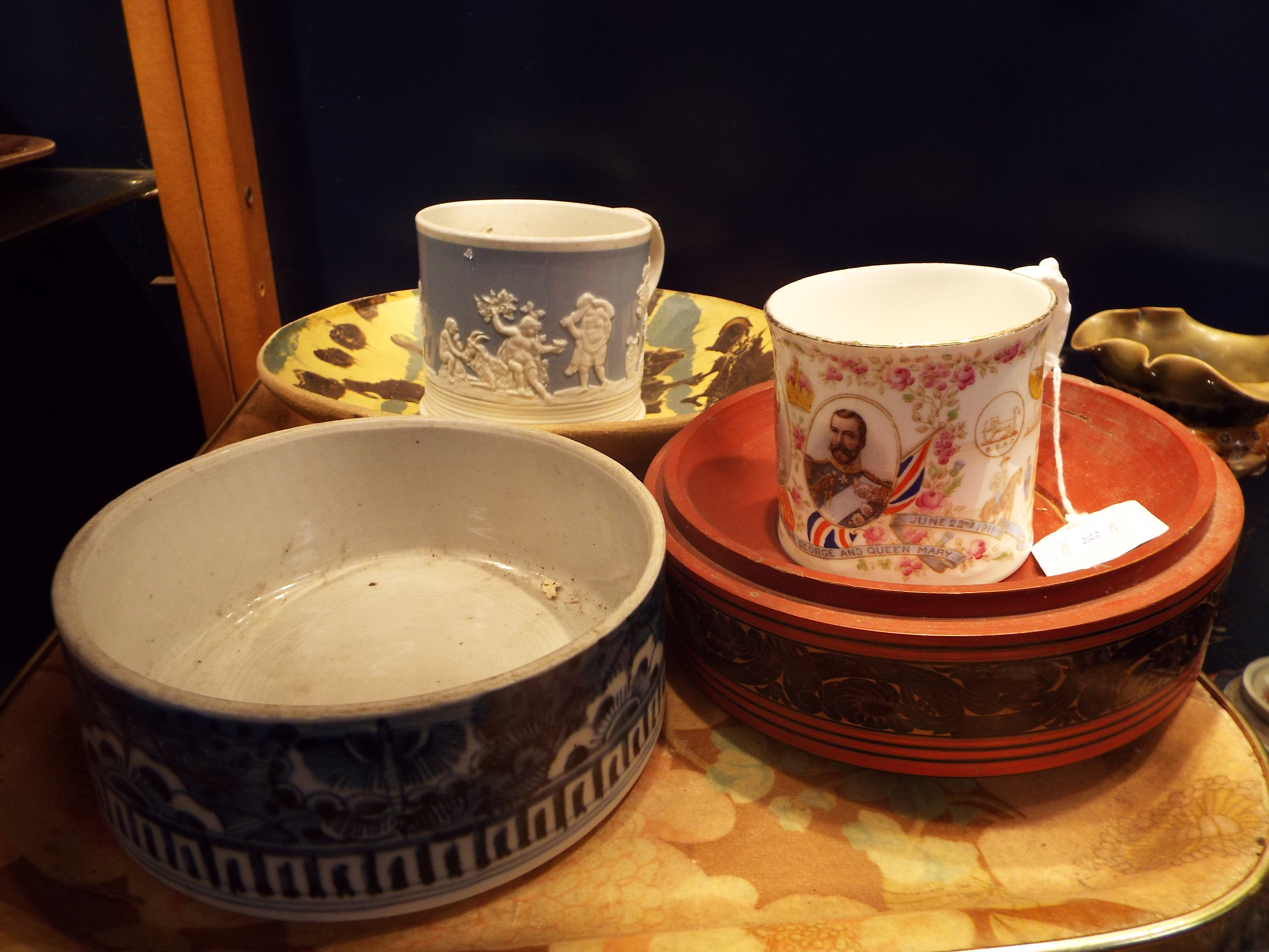 An Aynsley 1911 coronation mug and Italian slipware bowl, a red lacquered bowl,