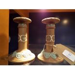 A pair of Doulton Lambeth Silicon Ware candle stick holders having Wedgwood style pattern,