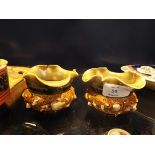 A pair of unusual Royal Doulton Art Nouveau flared rim pots moulded in relief with sea shells,