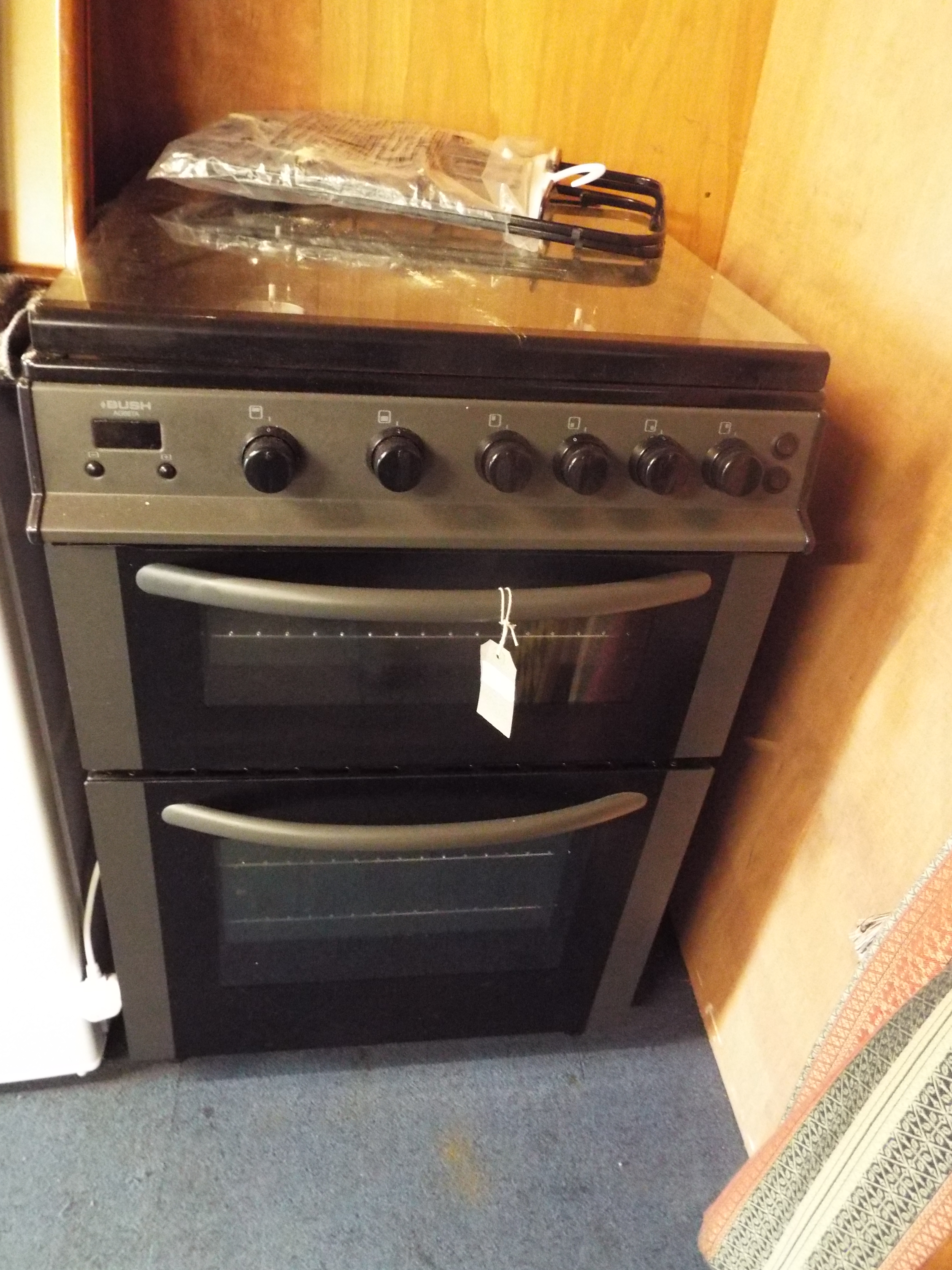 A Bush AG66TA four hob gas cooker