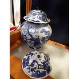 A large Chinese blue and white ginger jar decorated with figures, buildings and ponds,