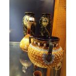 A Royal Doulton three handled cauldron vase having gilt decoration, a Royal Doulton vase,