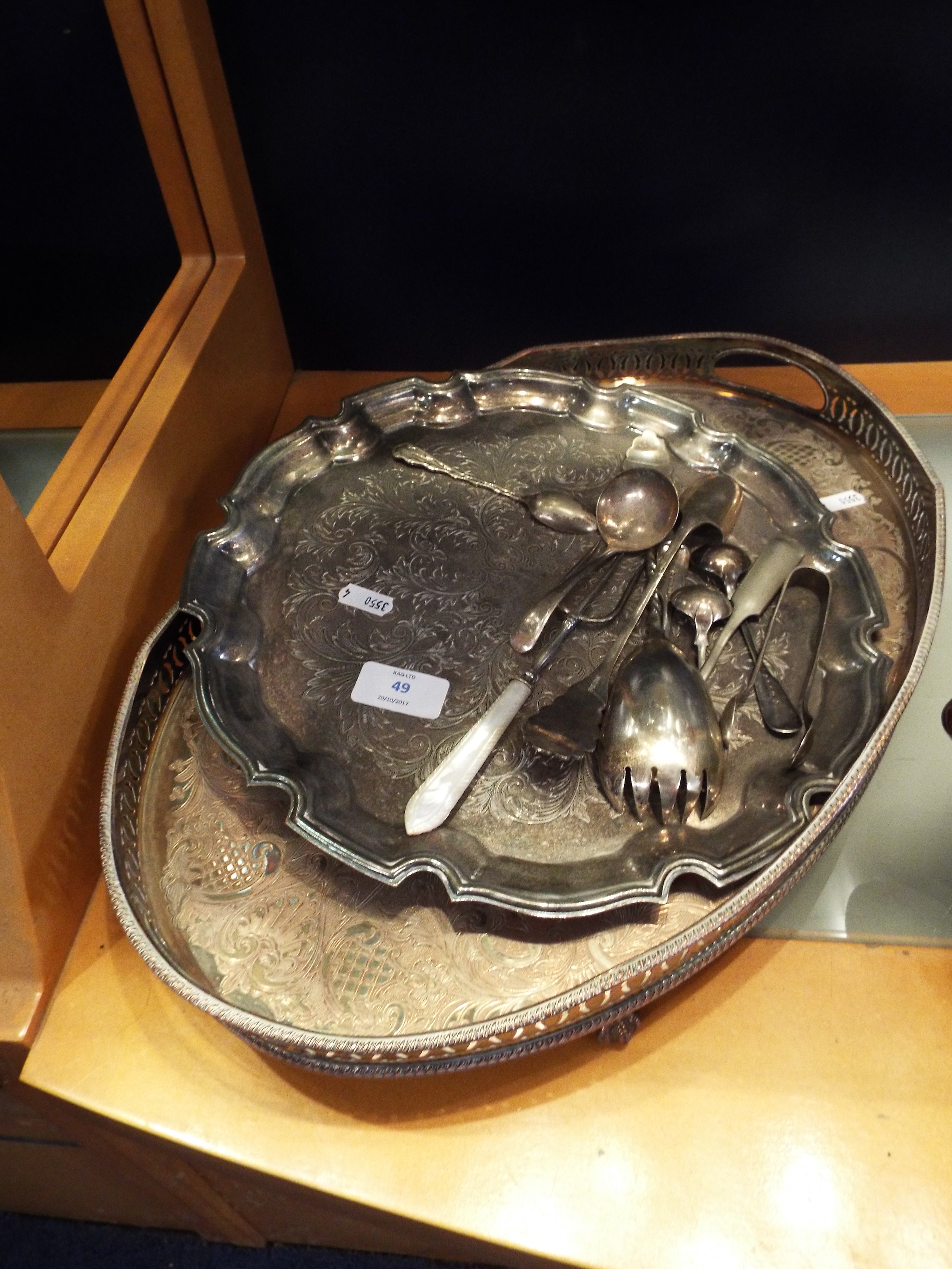 A silver plated tray and plater together with a small selection of cutlery