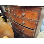 A Victorian bow-fronted mahogany chest of two short over three long graduated cock-beaded drawers