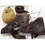 A selection of mostly leather holsters leather belt and a military water canteen
