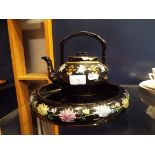 A black bowl having floral decoration together with a matching teapot A/F