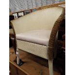 A Lloyd Loom style white painted armchair