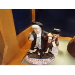 A Staffordshire style figurine of two gentlemen drinking