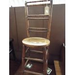 A Victorian mahogany correction chair with cane seat and faux bamboo back and legs