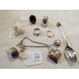 A selection of silver rings and teaspoons with dogs head finial