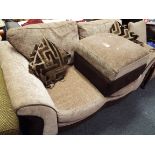 A two seater sofa with matching foot stool having beige and chocolate upholstery