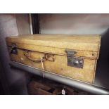 A vintage vellum suitcase