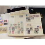 Four stamp albums containing assorted stamps to include USA,