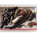 A selection of assorted vintage pipe bowls and mouthpieces