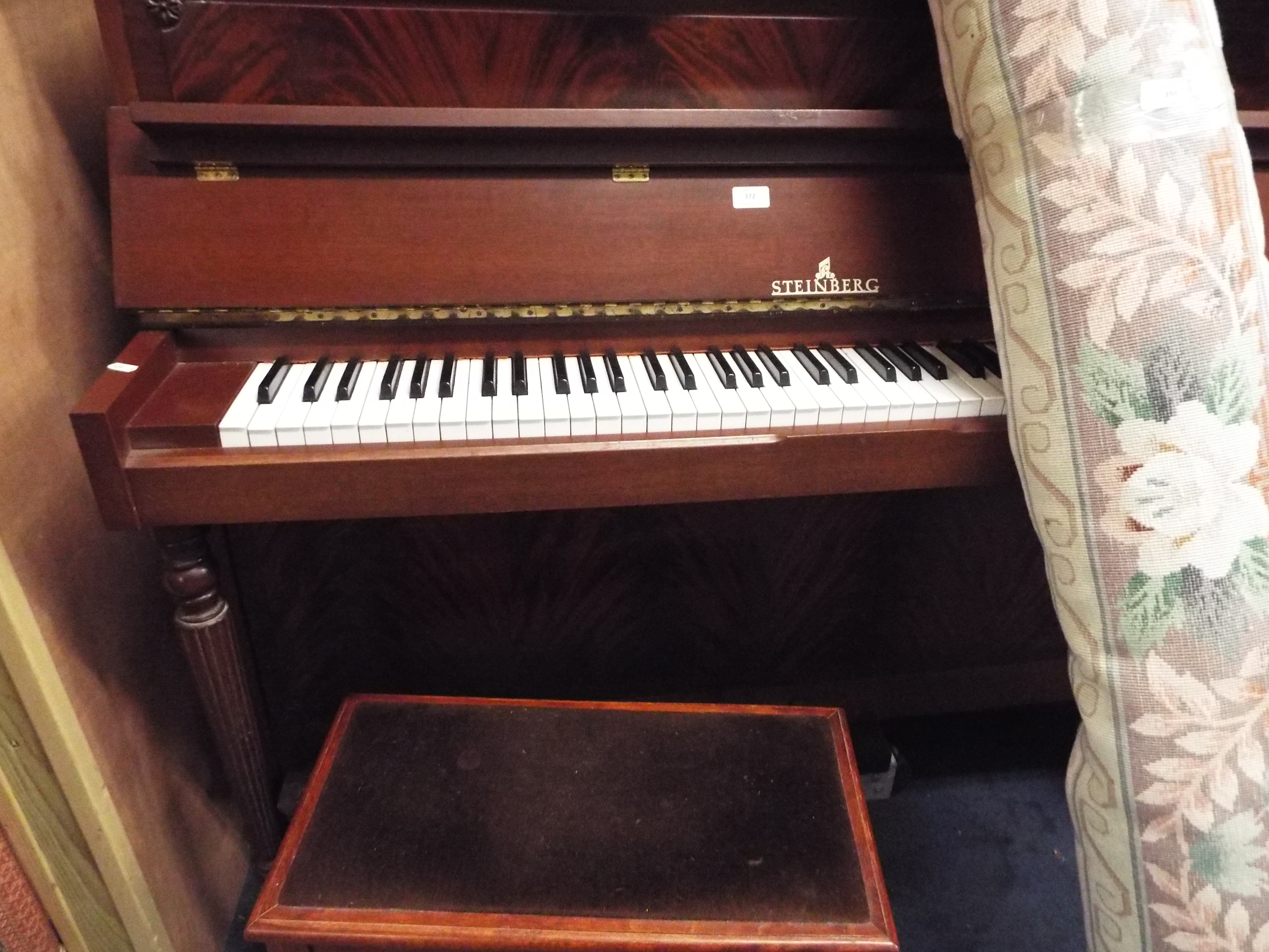 A Steinberg mahogany metal framed upright piano supplied by Harrods No.