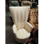 A cream upholstered high-back bedroom chair