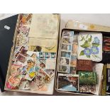 A quantity of stamps loose and in an album together with two matchboxes