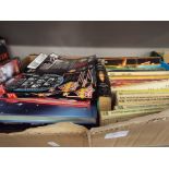 A box of assorted vintage Doctor Who paperback books, annuals,