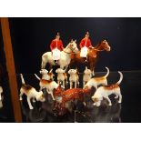 A Beswick hunting group comprising of huntsman on grey dapple, No 1501, huntsman on bay No 1501,