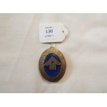 An oval silver and blue enamel Masonic medallion inscribed 'London' and dated Birmingham 1970 by