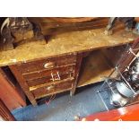 An oak work bench fitted with vice and drawers