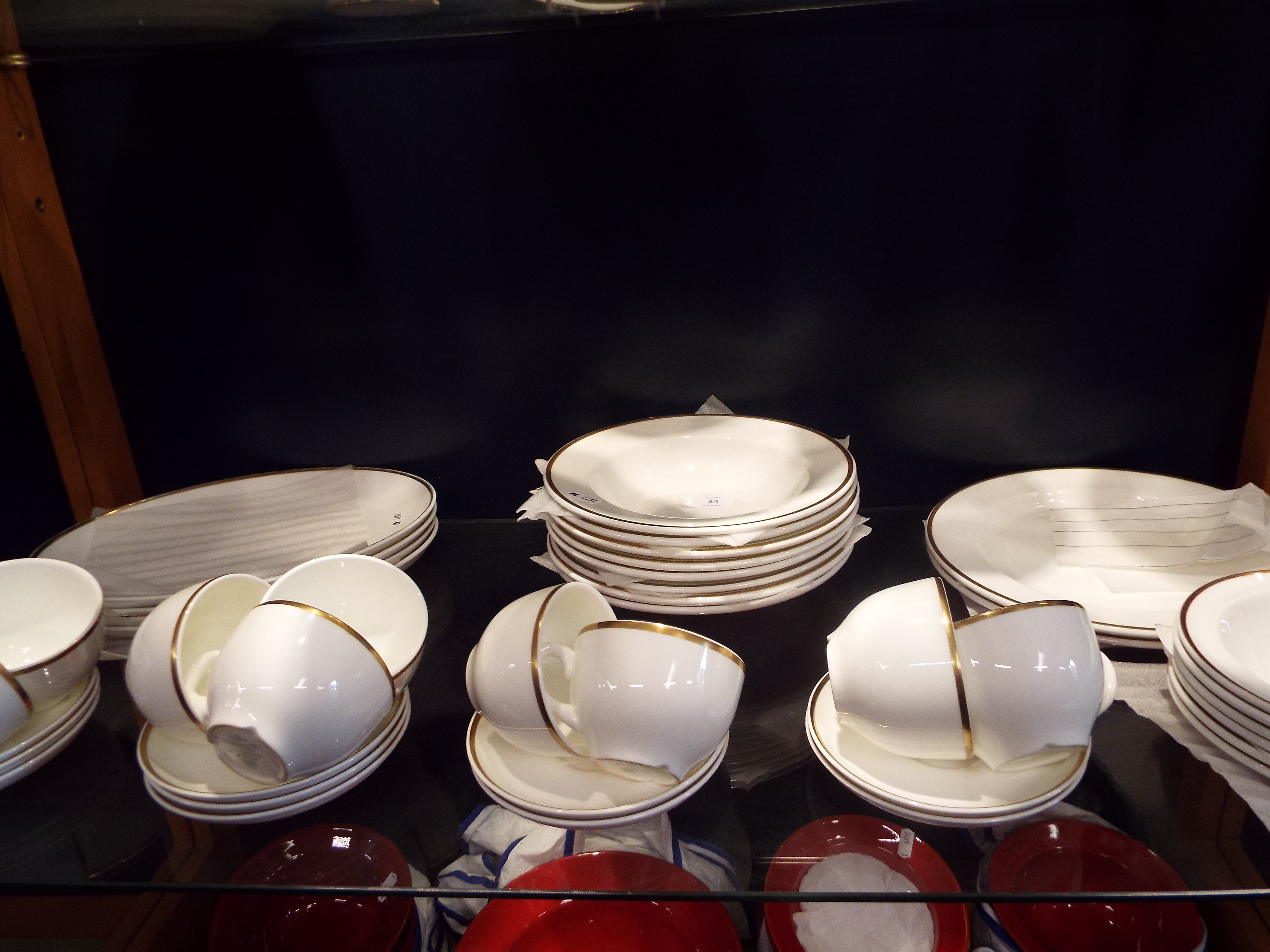 A selection of Wedgwood bone china gilt rimmed dinner-ware to include plates, bowls,