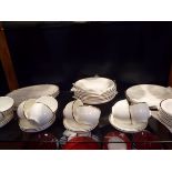 A selection of Wedgwood bone china gilt rimmed dinner-ware to include plates, bowls,