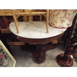 A Victorian mahogany demi-lune console table the marble top over a plain frieze with central