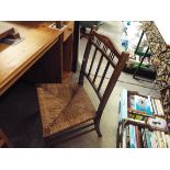 An Edwardian inlaid and boxwood strung mahogany side chair with rush upholstered seat