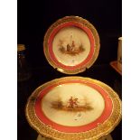 A pair of continental hand painted cabinet plates with figures in exterior scenes to centre and