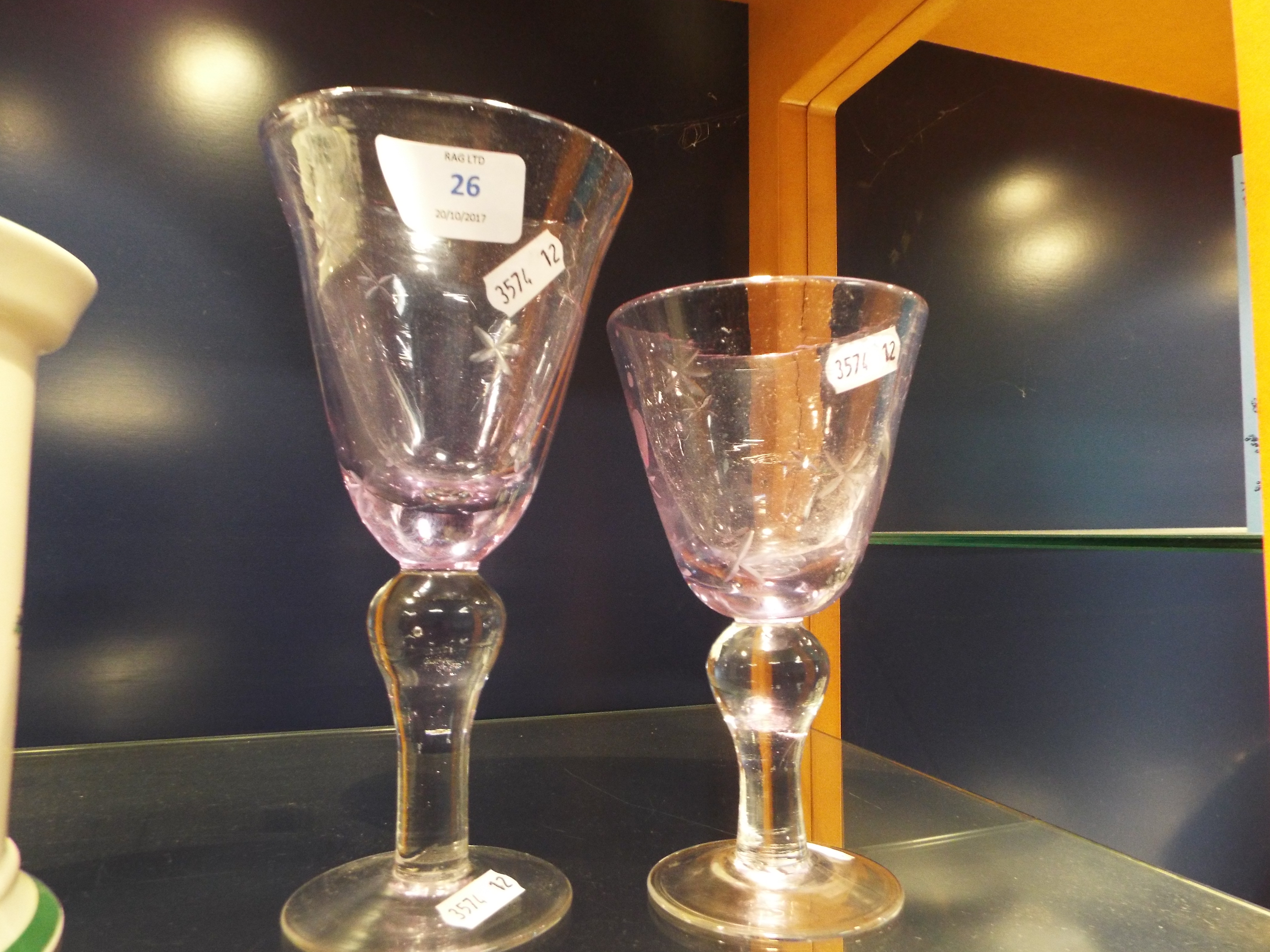 Two hand blown soda glass goblets with etched star design