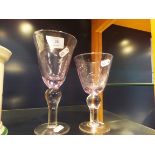 Two hand blown soda glass goblets with etched star design