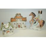 Staffordshire Tom King flatback and two Staffordshire pastille burner cottages (one cottage a/f)