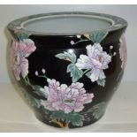 Large jardiniere with pastel painted flowers on black ground