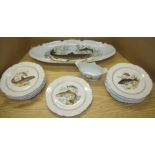 Set of eleven Limoges fish plates with matching large serving dish and small twin handled sauce jug