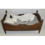 19th C dolls Arts & Crafts dolls bed with small doll with bisque head,