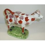 Staffordshire cow cream with painted lustre design (a/f)